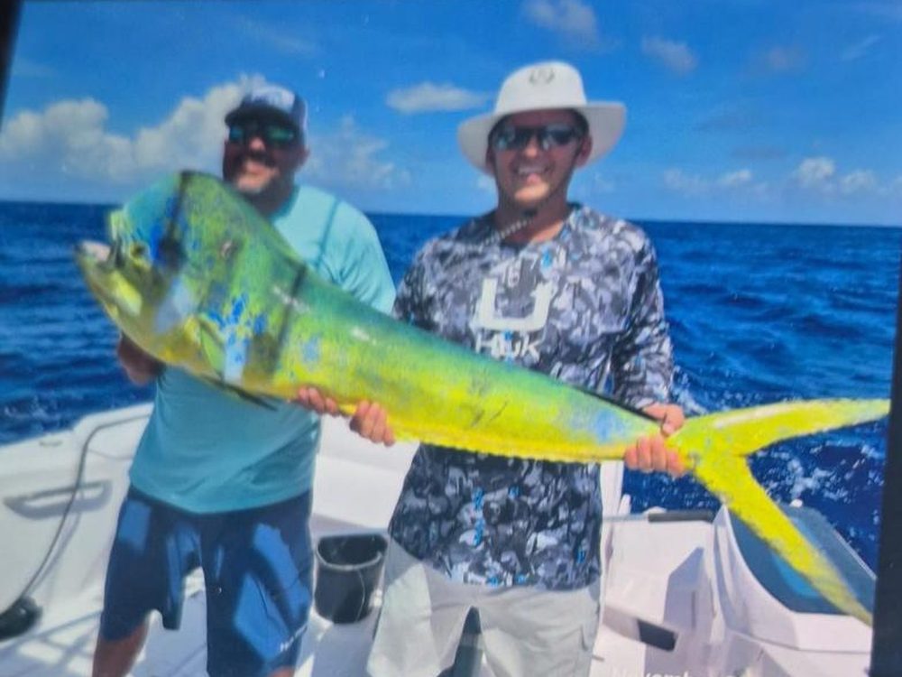 Anglers with a large mahi-mahi caught offshore off Bonaire
